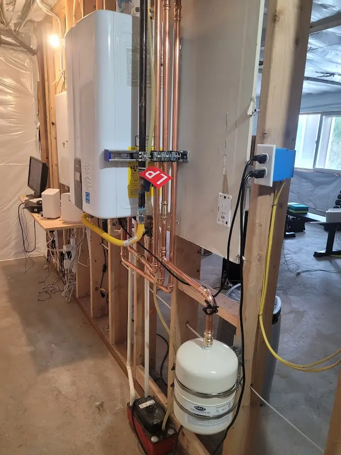 Licensed plumber repairing a kitchen sink in Pinson
